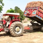 A man driving a tractor trolley in pakistan